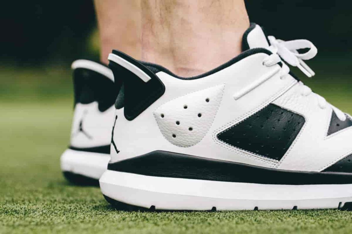 White leather golf shoes